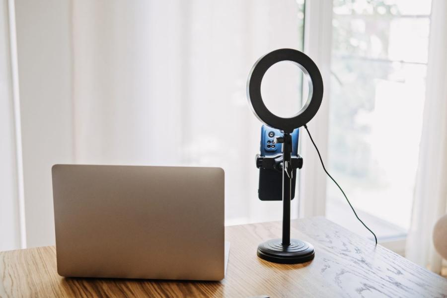 Personal computer, light ring and stand with phone holder to record video and video-streaming at home.